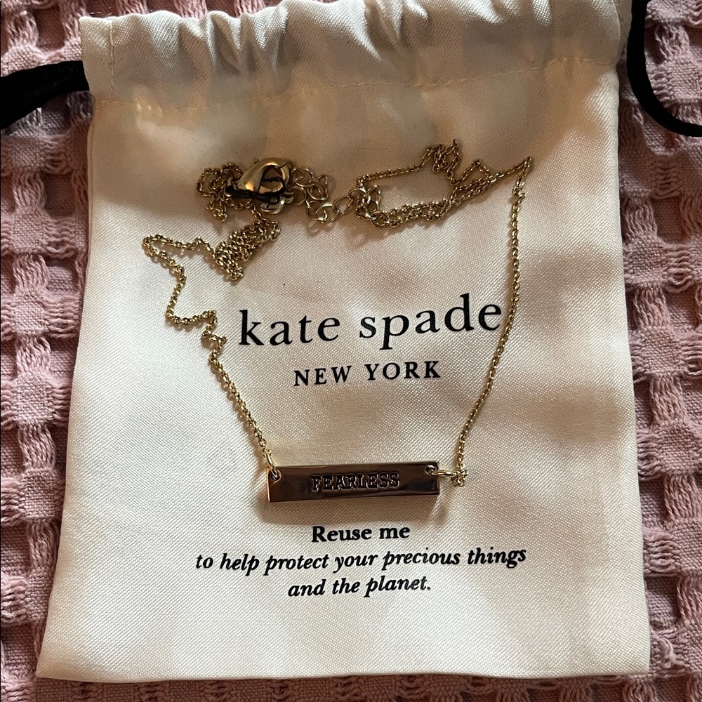 NWOT Kate Spade Fearless gold tone necklace.